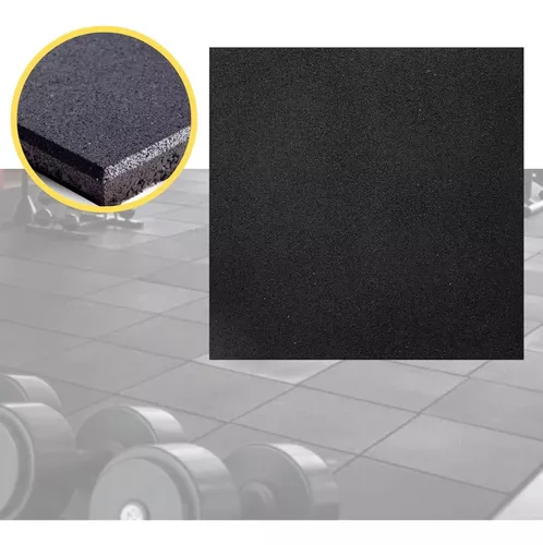 piso de borracha preto, sendo usado na academia